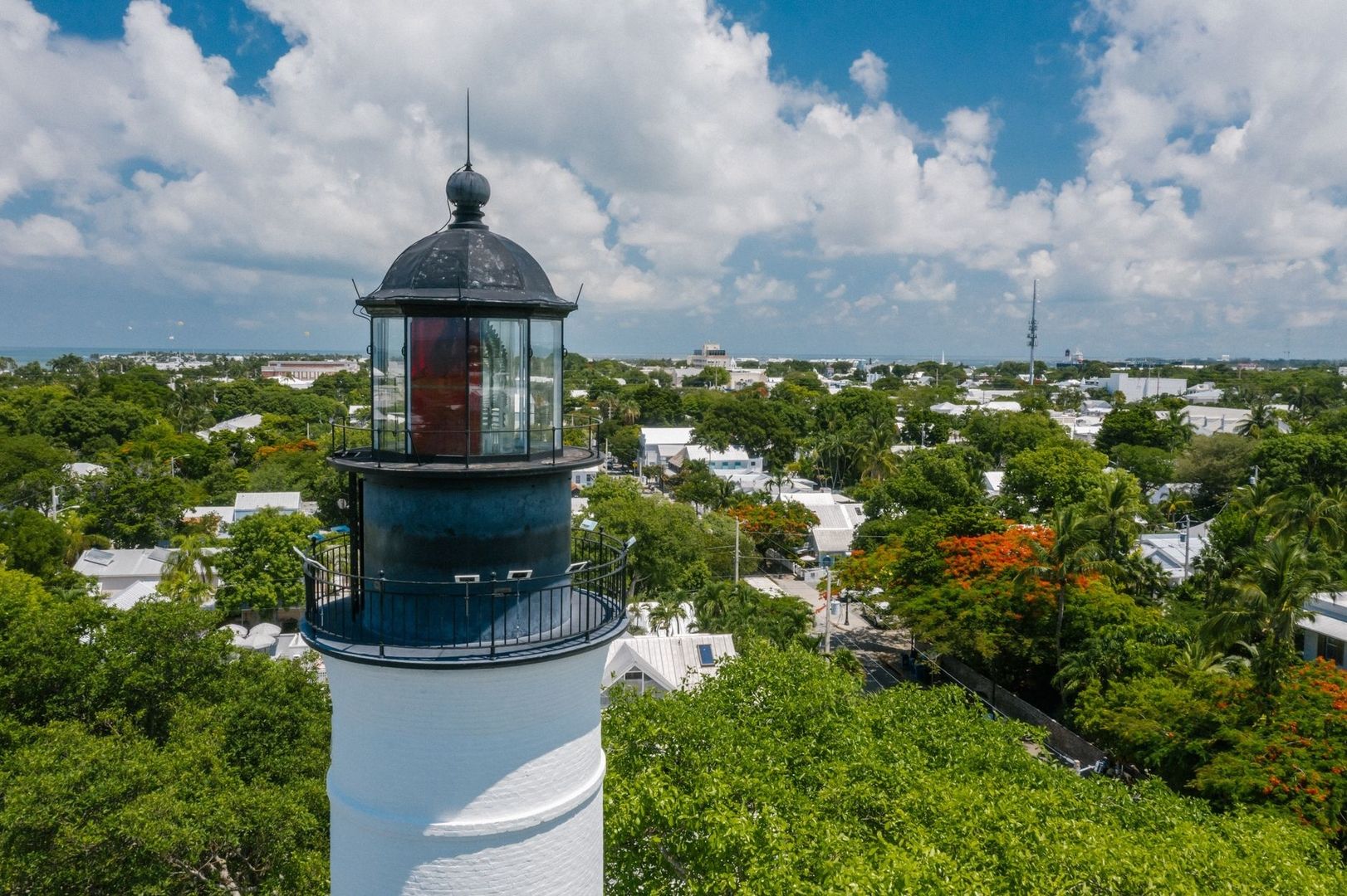 Key West lighthouse overlooking the tropical city and distant sea